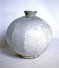 Cut sided stoneware vase with ash glaze