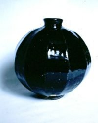 John bedding cut sided stoneware vase in Tenmoku glaze